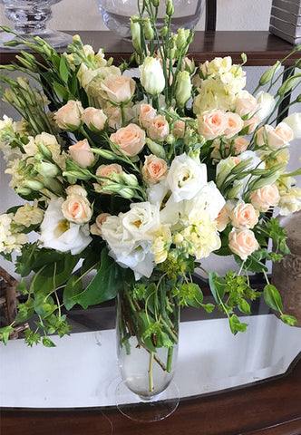 Premium arrangement of blush flowers such as roses and lisianthus