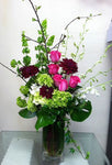 beautiful arrangement of seasonal flowers such as roses and hydrangeas 