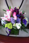 colorful arrangement of roses, lilies and hydrangeas 