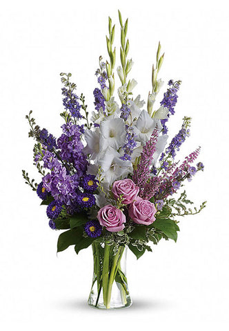 White and lavender sympathy flower bouquet in a vase