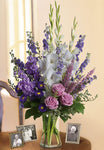 Sympathy vase arrangement with white and lavender flowers